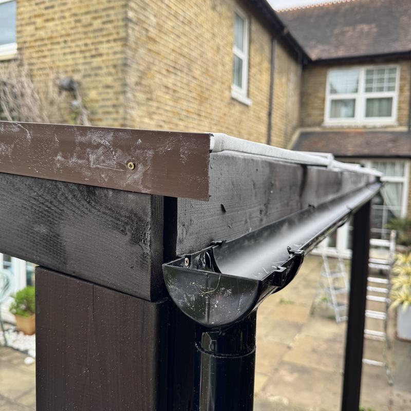 Pergola corner with gutter and downpipe