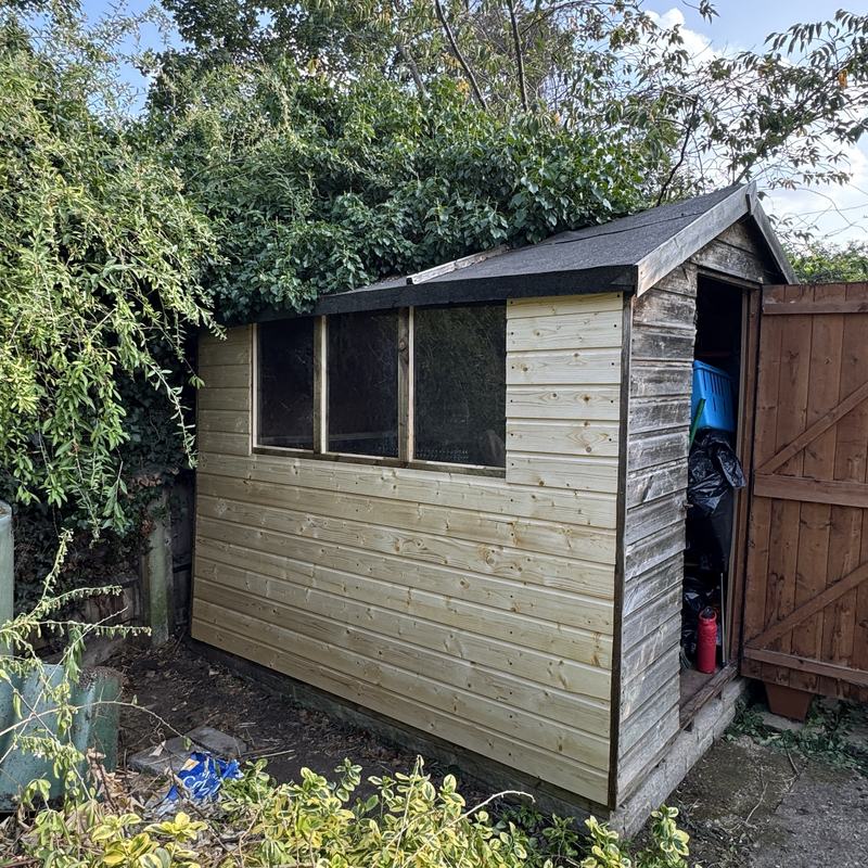 Garden shed re-clad in new timber